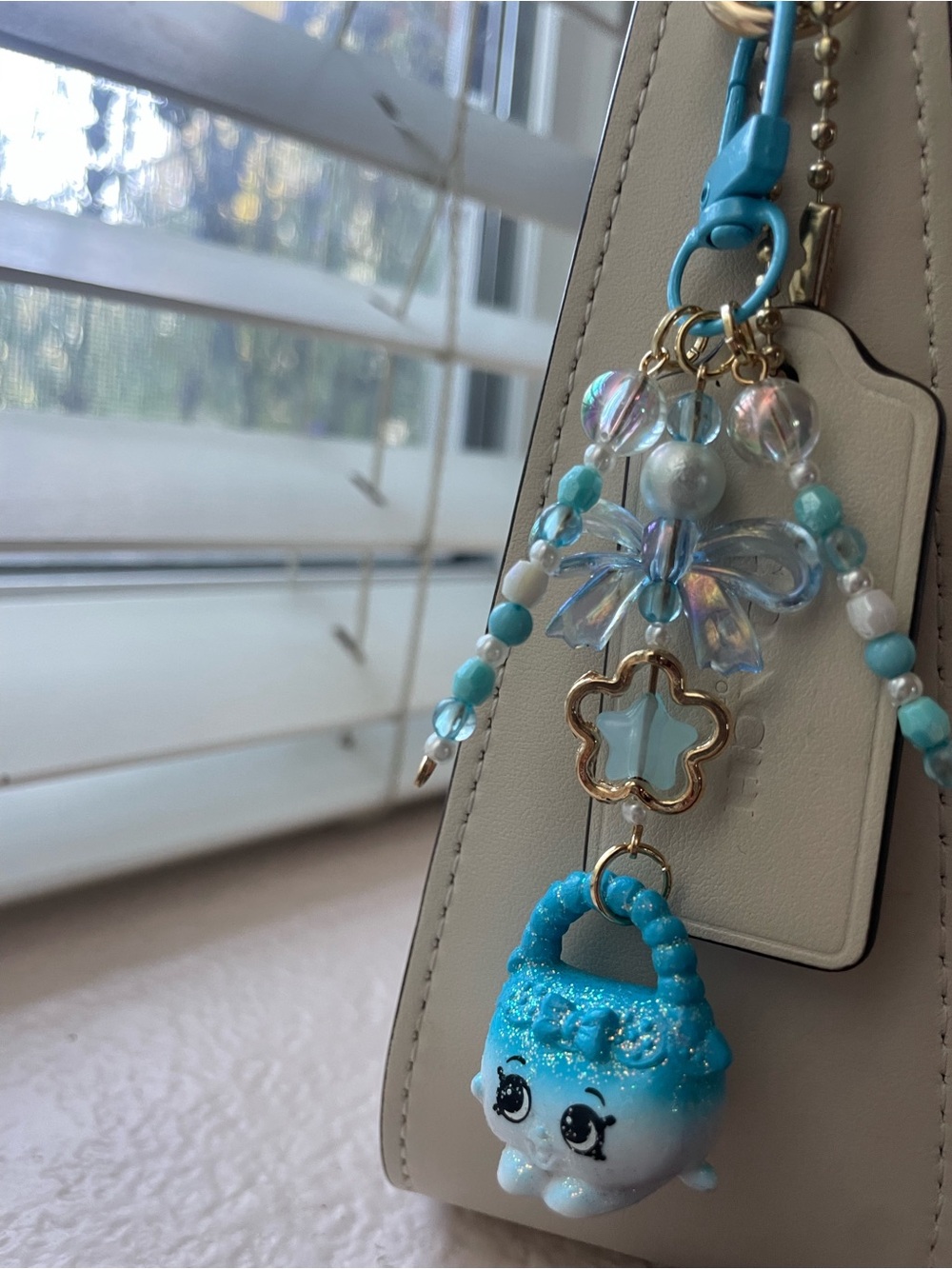 Shopkins Blue Beaded Bag Charm with Flower and Star Accents